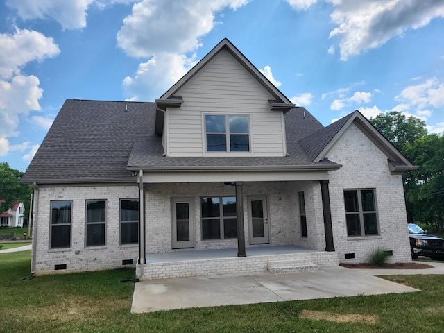 back of house with a patio, ceiling fan, and a lawn