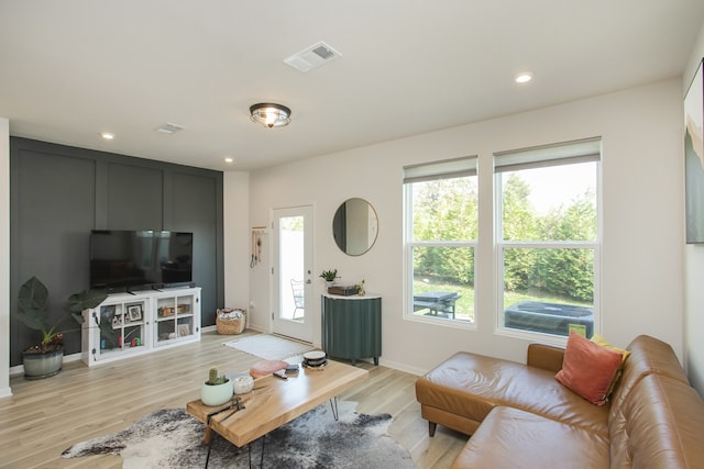 living room with light hardwood / wood-style flooring