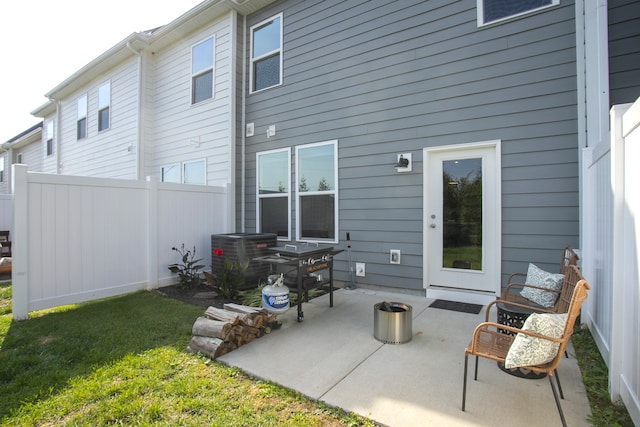 back of property featuring a yard, a patio area, and central AC unit