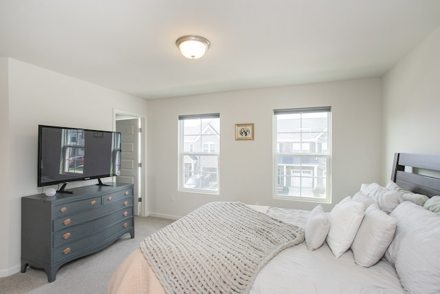 bedroom with light carpet