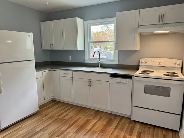 kitchen with light hardwood / wood-style flooring, white cabinets, sink, and white appliances