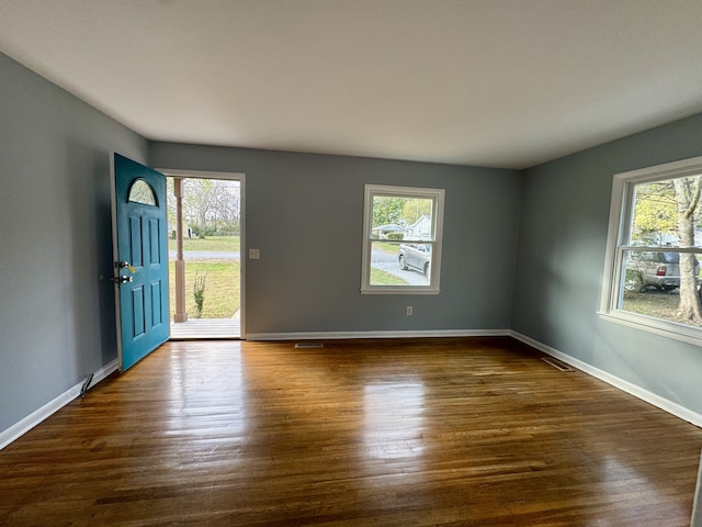 entrance foyer with dark hardwood / wood-style flooring