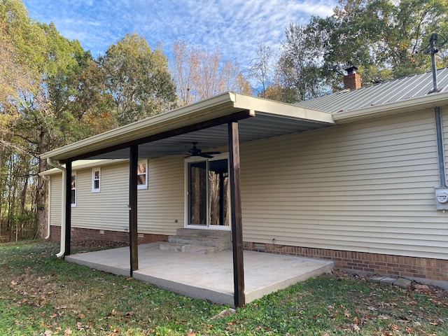 exterior space featuring ceiling fan