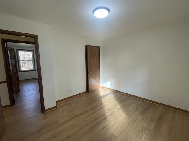 empty room with hardwood / wood-style floors