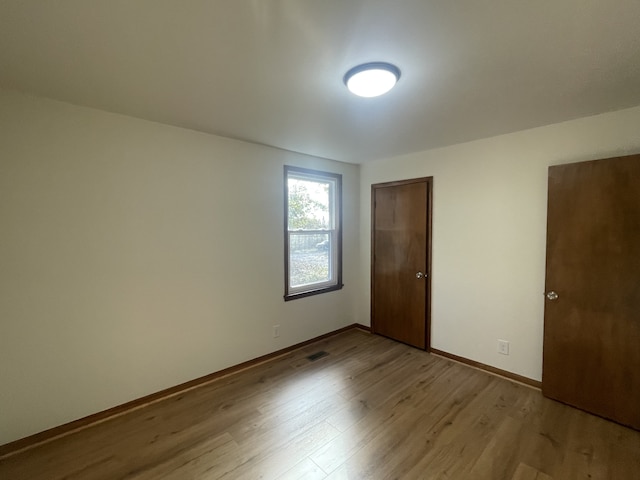 empty room with light wood-type flooring