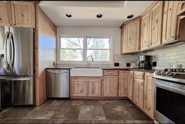 kitchen with sink, decorative backsplash, stainless steel appliances, and light brown cabinets