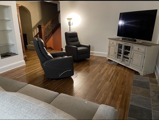 living room featuring dark wood-type flooring