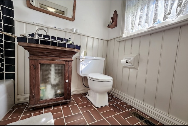 bathroom with vanity, toilet, and tile patterned floors