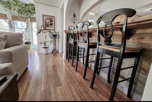 hallway with hardwood / wood-style floors