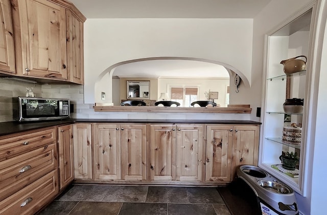 kitchen with backsplash and light brown cabinetry