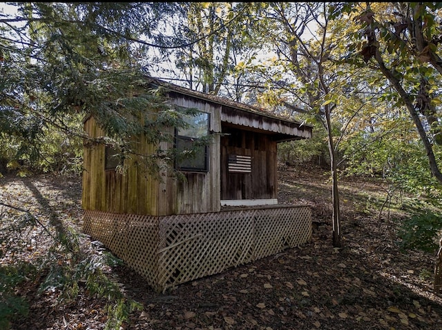 view of side of home with an outbuilding