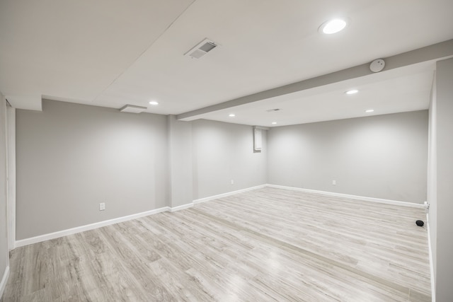 basement featuring light hardwood / wood-style floors