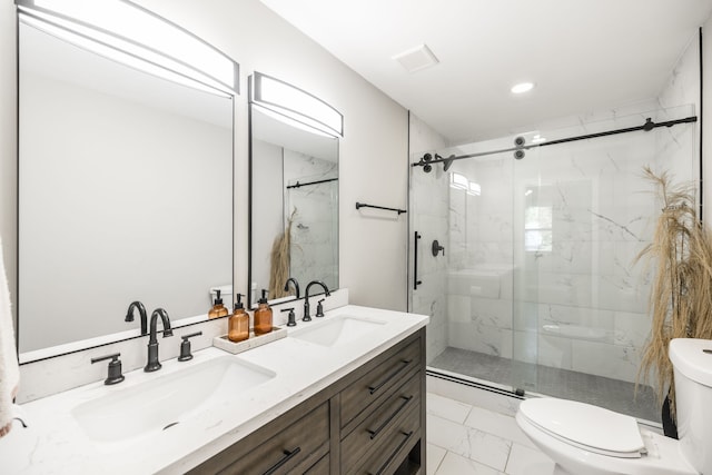 bathroom with vanity, toilet, and an enclosed shower