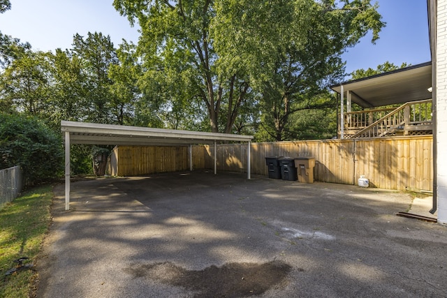 view of vehicle parking with a carport