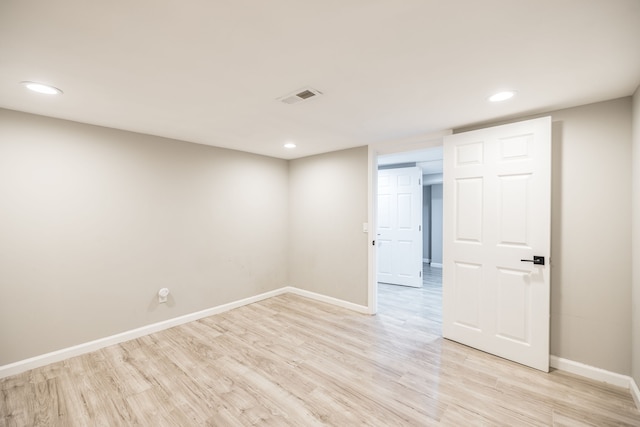 spare room with light hardwood / wood-style floors