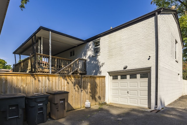 view of side of property with a garage