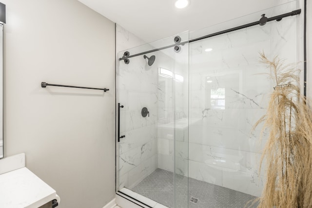 bathroom with vanity and a shower with shower door