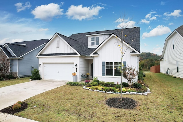 modern farmhouse with a shingled roof, concrete driveway, a front yard, board and batten siding, and brick siding