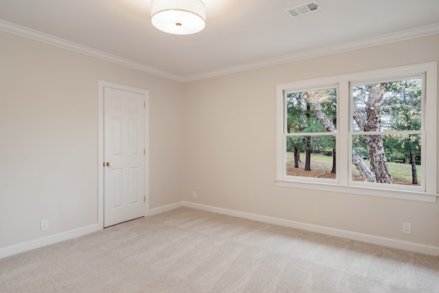 unfurnished room with crown molding and light colored carpet