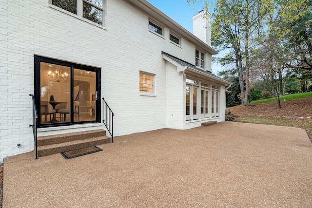 rear view of property with a patio area