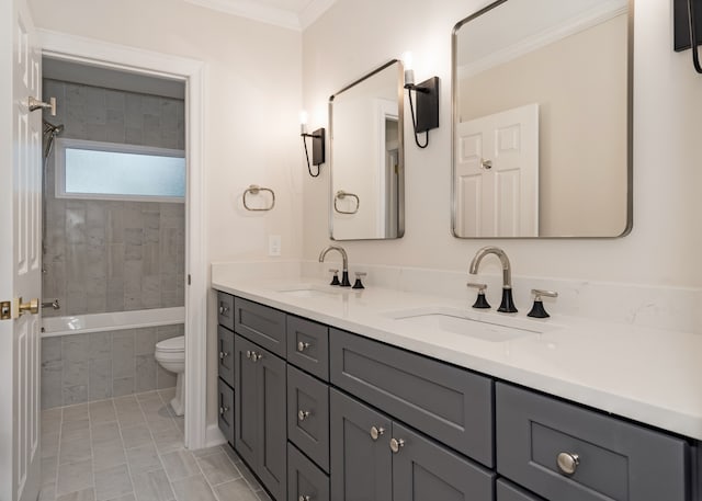 full bathroom featuring vanity, tiled shower / bath combo, crown molding, tile patterned flooring, and toilet