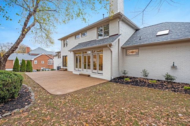 back of property featuring a patio