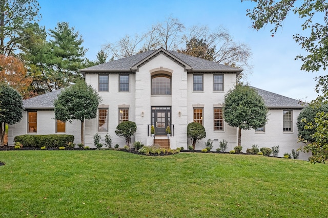 colonial-style house with a front yard