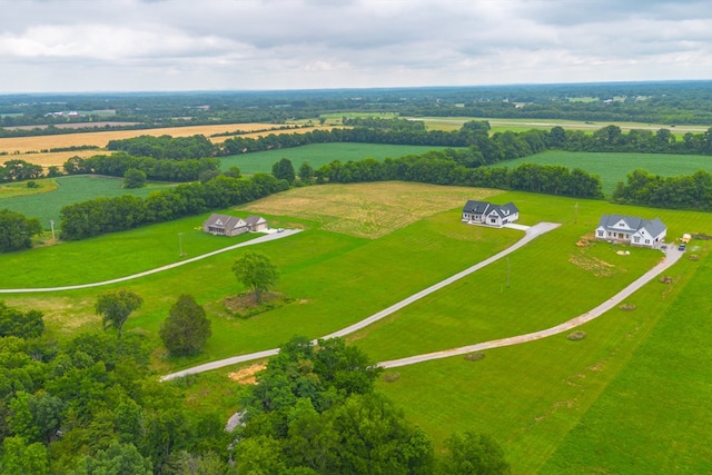 birds eye view of property with a rural view