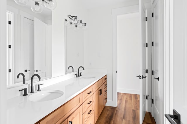 bathroom featuring vanity and wood-type flooring