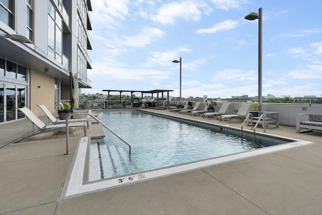 view of pool featuring a patio