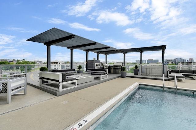 view of pool with area for grilling, a patio area, and an outdoor living space