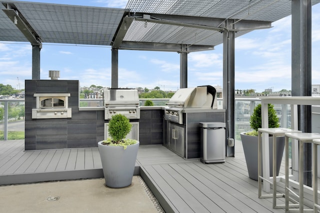 deck featuring an outdoor kitchen and grilling area