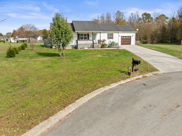 ranch-style home with a front lawn, a garage, and covered porch