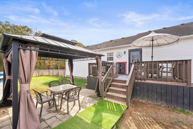 exterior space featuring a gazebo and a deck