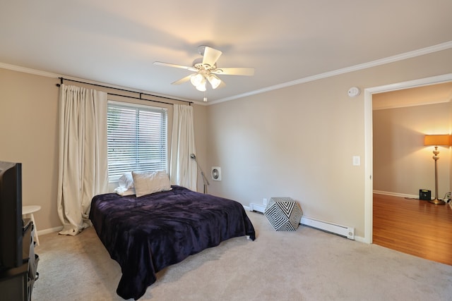 bedroom featuring ornamental molding, a baseboard heating unit, light wood-type flooring, and ceiling fan