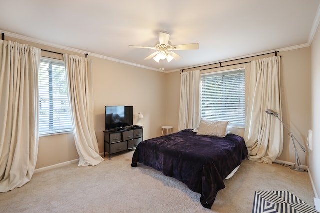 bedroom featuring light carpet, crown molding, and ceiling fan