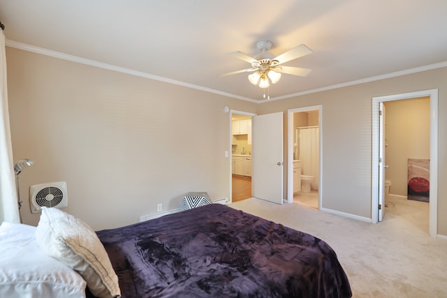 carpeted bedroom with ornamental molding, ceiling fan, and ensuite bath