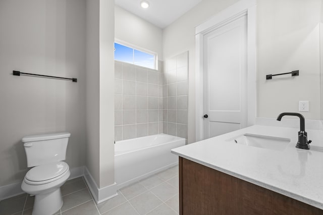 full bathroom with toilet, vanity, tiled shower / bath, and tile patterned flooring