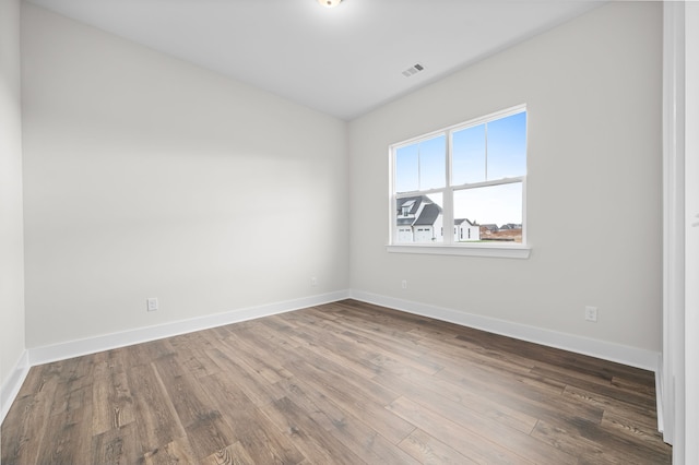 empty room with wood-type flooring