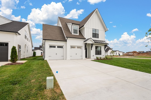 view of front facade with a garage and a front lawn