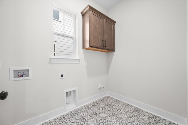 laundry room featuring cabinets, hookup for a washing machine, hookup for a gas dryer, and electric dryer hookup