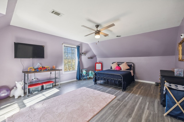 bedroom with dark wood-type flooring, ceiling fan, and lofted ceiling