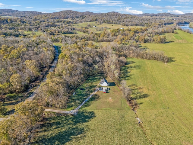 drone / aerial view with a water and mountain view