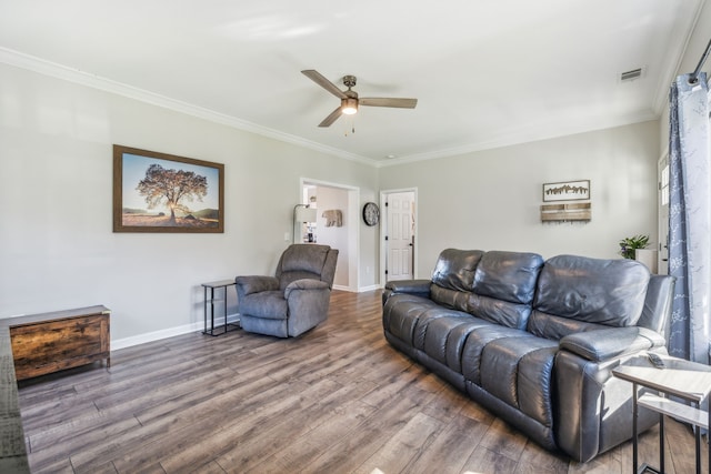 living room with ornamental molding, wood-type flooring, and ceiling fan