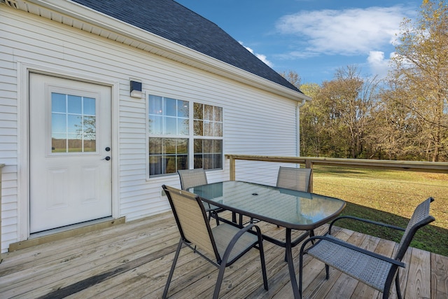 wooden deck featuring a yard