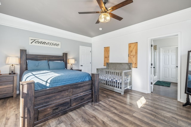 bedroom with ceiling fan, ornamental molding, and wood-type flooring