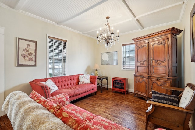 living room featuring dark wood-type flooring, a notable chandelier, and ornamental molding