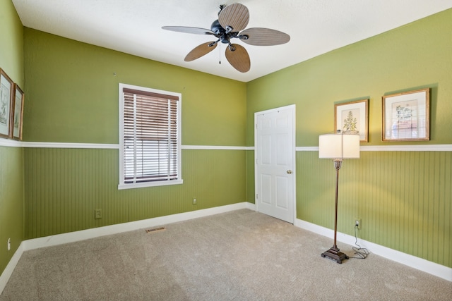 empty room with light carpet and ceiling fan