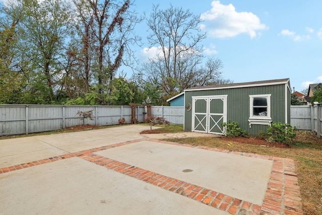 view of patio with a storage shed