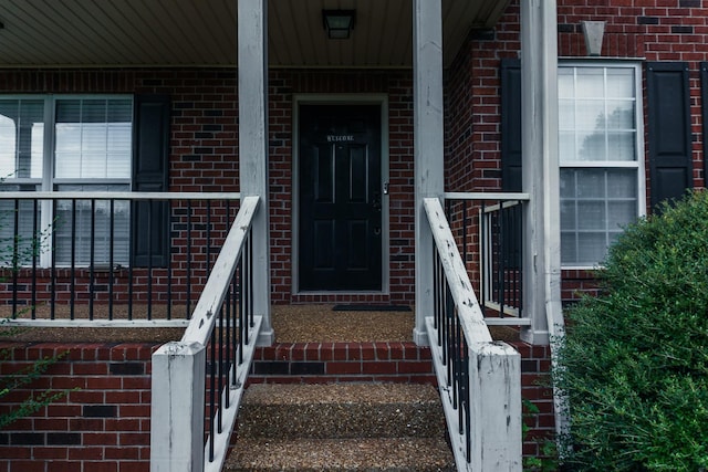 101 Brookstone Dr, Burns, TN 37029 - doorway to property with a porch and brick siding